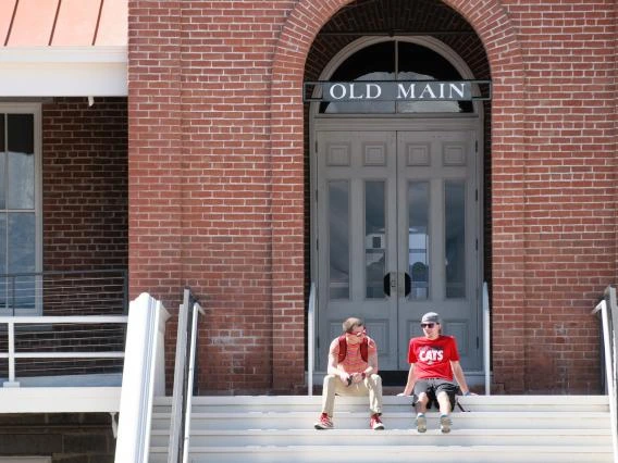 students on steps of old main